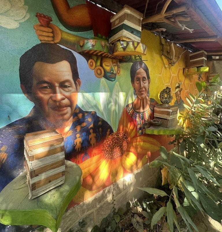 A colorful mural on the wall of the Xunah Kaab stingless bee farm in San Juan La Laguna